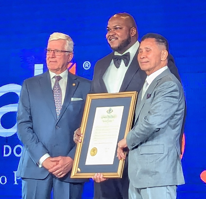 At Crystal’s recent anniversary gala, Crystal CEO Jeff Smith (l.) and Chairman Thomas Chen (r.) receive a congratulatory citation from NYS Governor Hochul, presented by the governor’s Regional Director Aaron Ambrose