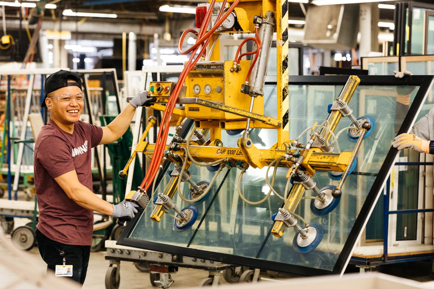factory employee working with glass handler
