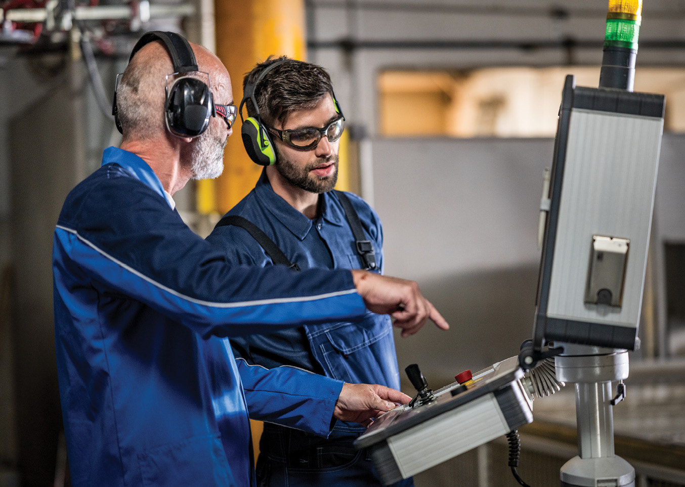 two employees on factory floor